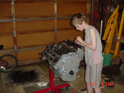 1989 Ford Bronco - My son Jacob running down the head bolts