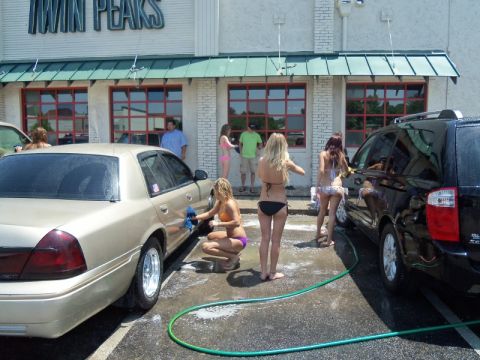 2000 Mercury Grand Marquis - Women wash vehicles outside a Twin Peaks restaurant.