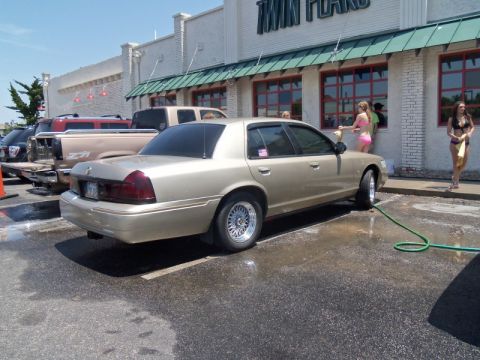 2000 Mercury Grand Marquis - A gold sedan is being washed at Twin Peaks Carwash.