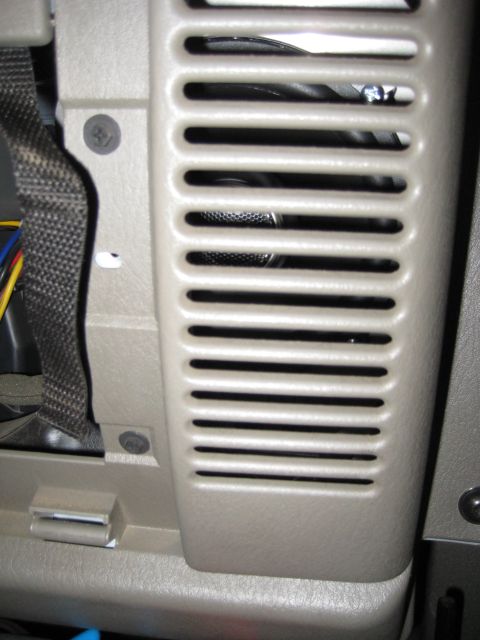 2005 Jeep Wrangler - Close-up of a vehicle's interior speaker grille, showing its textured surface and horizontal openings.