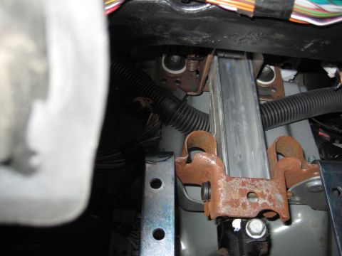 2005 Jeep Wrangler - This photo shows the wiring and metal brackets inside a vehicle's dashboard area.