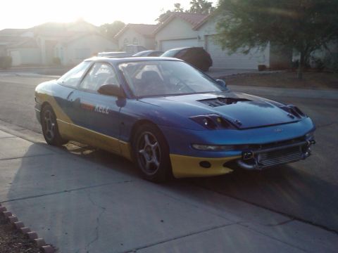 1995 Ford Probe - 1995 Ford Probe coupe seen from a 3/4 front angle on a street.