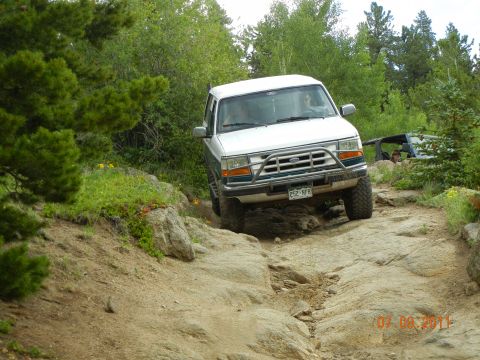 1996 Ford Bronco - This 1996 Ford Bronco is tackling a challenging rocky off-road path.