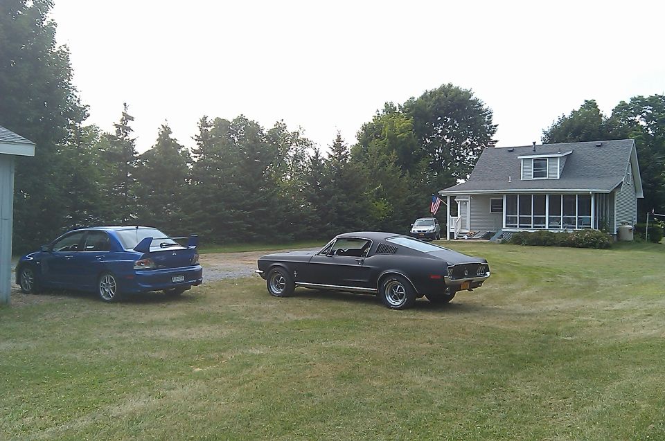 My Evolution and Mustang enjoy the sunshine on my freshly mowed lawn. Katie's recently tuned-up CR-V looks on.