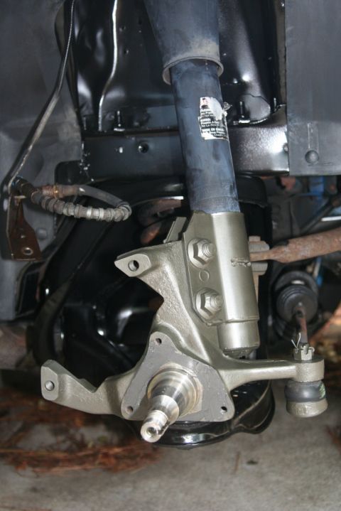 1980 Ford Mustang - Front suspension component, likely a spindle and associated parts, photographed for a registry.