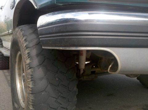 1996 Ford Bronco - Close-up of the rear tire and chrome bumper on a 1996 Ford Bronco.