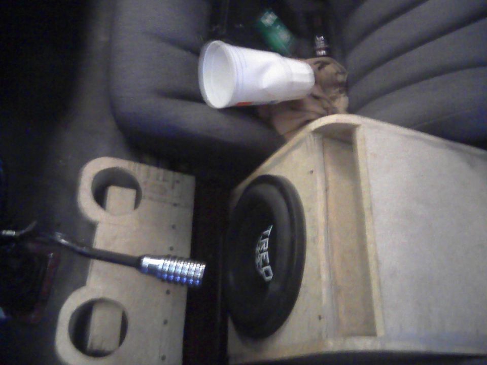 CUSTOM SEAT FRAME THAT USES THE FACTORY SLIDERS, BOTH SEATS  MOVE AS ONE LIKE THE FACTORY BENCH SEAT.  BUCKETS OUT OF A 2000 SOMETHING CAVALIER, THEY ACTUALLY HAVE GOOD HIP AND SIDE SUPPORT. 

CUSTOM BUILT SUB BOX.