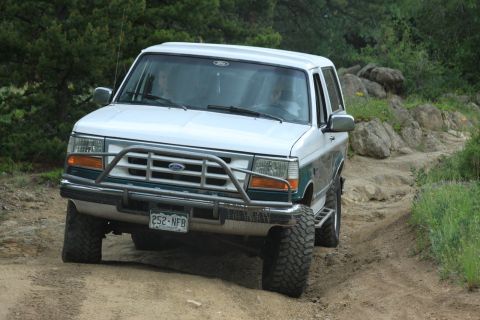 1996 Ford Bronco - This 1996 Ford Bronco is navigating a challenging off-road trail.