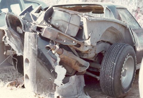 1976 Chevrolet Corvette - This heavily damaged 1976 Chevrolet Corvette shows significant rear-end collision impact.