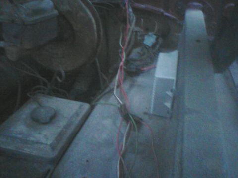 1988 Ford Bronco - Close-up view of wiring harness and engine components in an engine bay.
