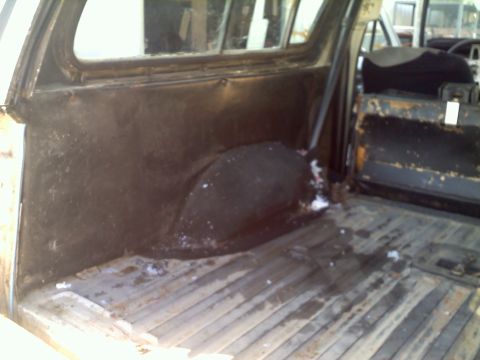 1978 Ford Bronco - View of the interior cargo area, showing the ribbed floor and the rear wheel well.