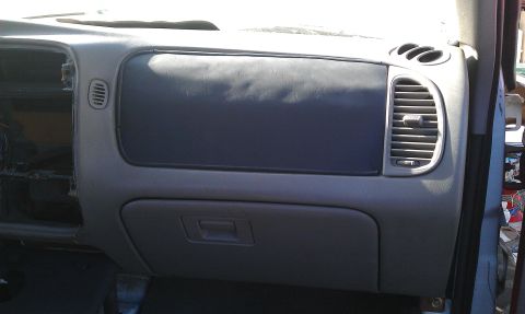 1992 Ford Ranger - Interior view of a 1992 Ford Ranger dashboard, showing the glove compartment and air vents.