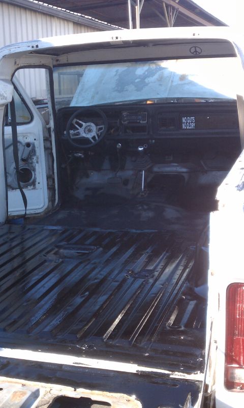 1978 Ford Bronco - Interior view of a white pickup truck, likely a Ford F-Series, with the bed and cab visible.