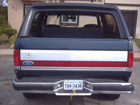 1990 Ford Bronco - The rear of a Ford Bronco shows its distinctive stripe and license plate.