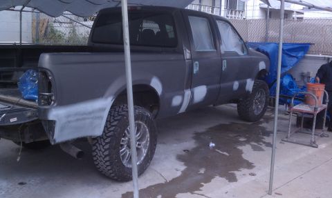 1978 Ford Bronco - Pickup truck bodywork in progress, with primer and filler visible on the panels, ready for a new paint job.