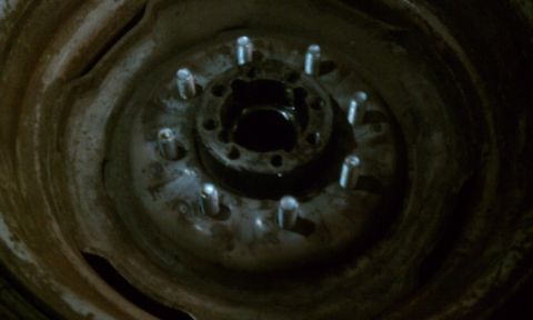 1978 Ford Bronco - This image shows a wheel hub with multiple lug bolts, likely from a vehicle's axle.