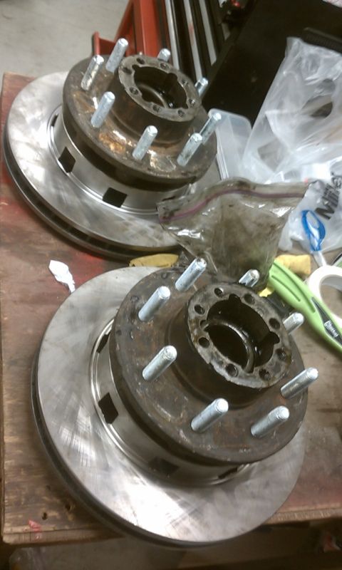 1978 Ford Bronco - Two brake rotor and hub assemblies are shown, appearing to be used or in need of refurbishment.