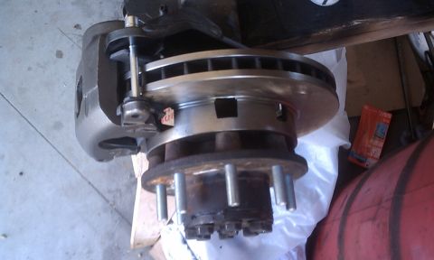 1978 Ford Bronco - Close-up of a vehicle's brake caliper and rotor assembly, likely for a truck or heavy-duty vehicle.