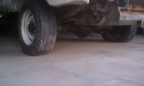 1978 Ford Bronco - Close-up view of the rear axle and tires of an unidentified vehicle.
