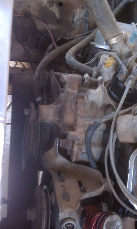 1978 Ford Bronco - Engine bay detail showing various mechanical parts and hoses.