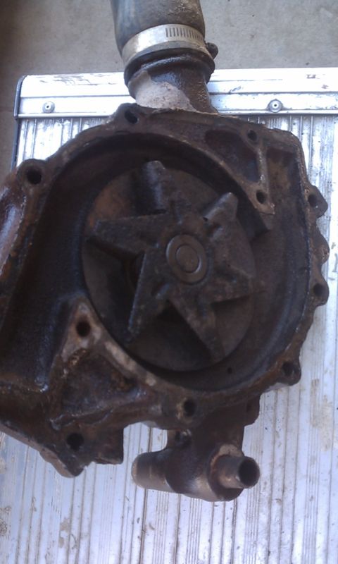 1978 Ford Bronco - This is a close-up of a used water pump, showing its internal impeller and attached hose.