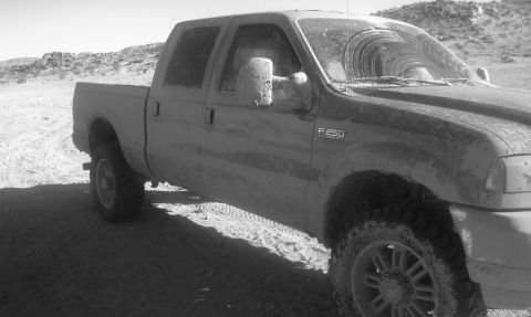 1978 Ford Bronco - This mud-splattered Ford F-250 is seen in a desert-like environment, possibly after an off-road excursion.