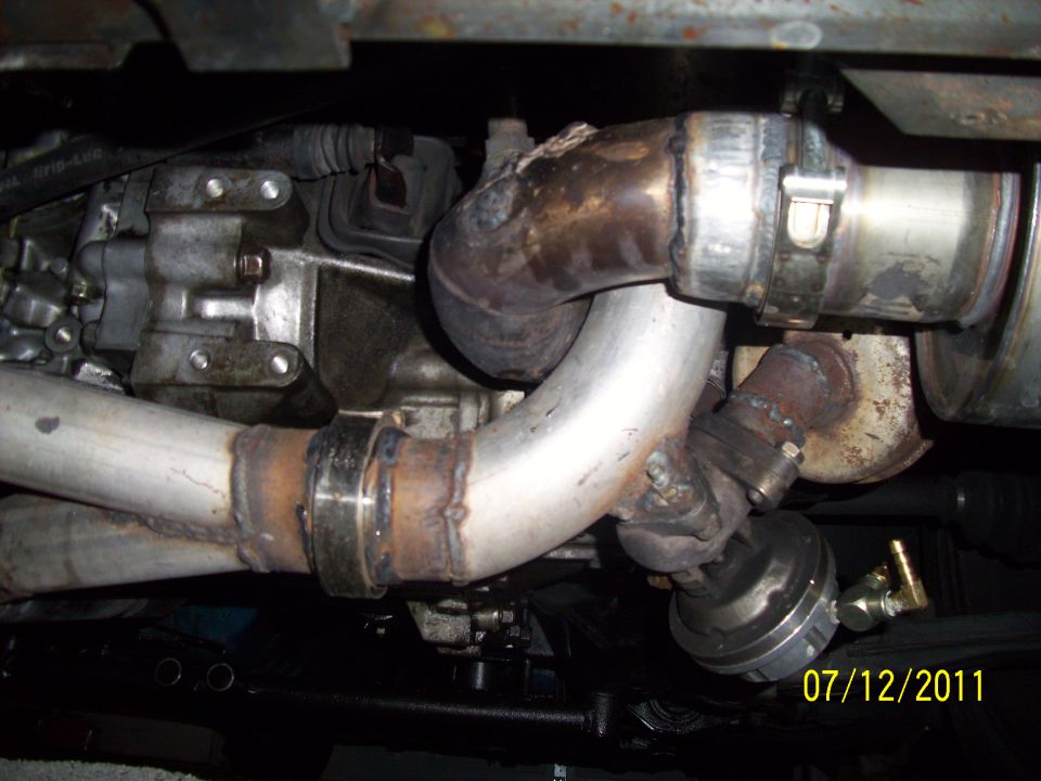 Exhaust piping and turbocharger components under a vehicle