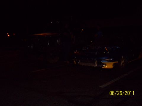 1995 Ford Probe - Car parked at night with visible date and website watermark.