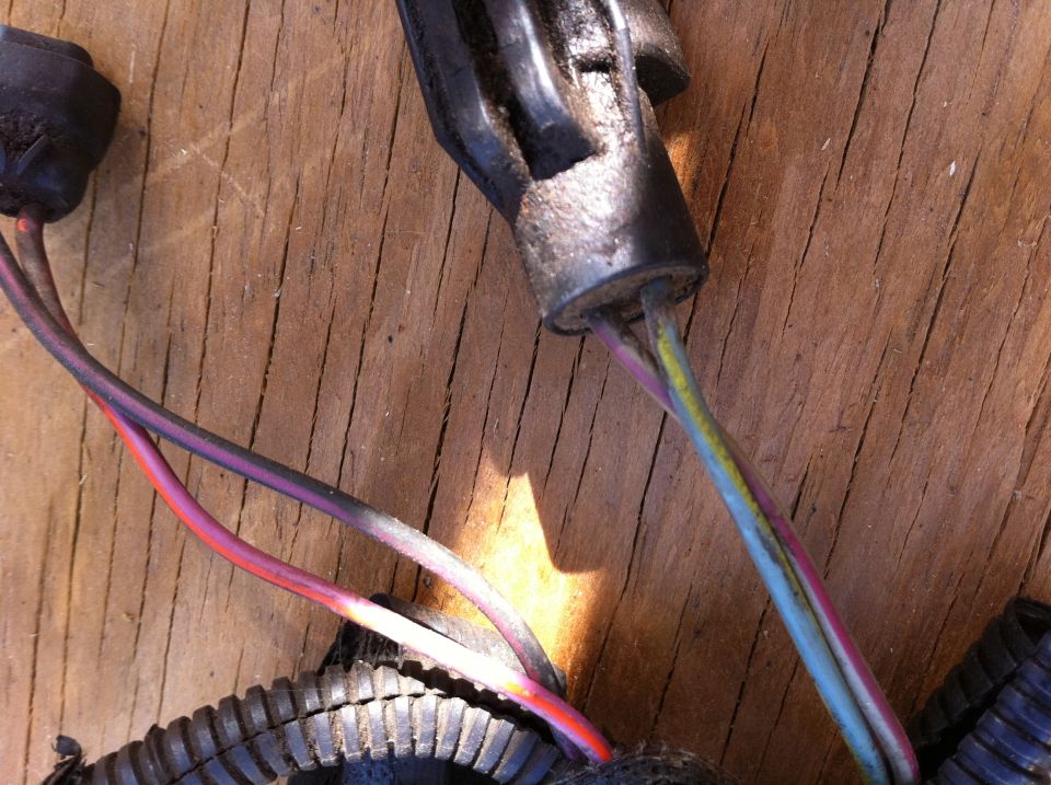 close-up of a wiring harness connector with multiple colored wires