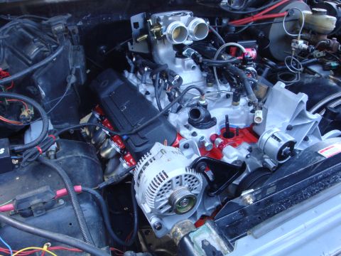 1989 Ford Bronco - Close-up view of a modified V8 engine, likely undergoing an upgrade or repair.