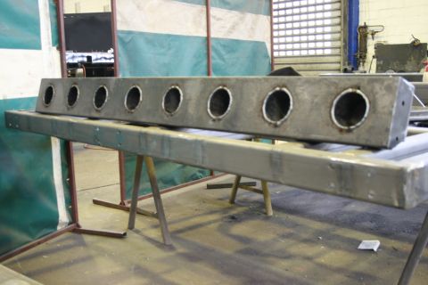 1973 Ford Ranchero - Fabricated metal part with multiple holes, likely for exhaust or lighting components.