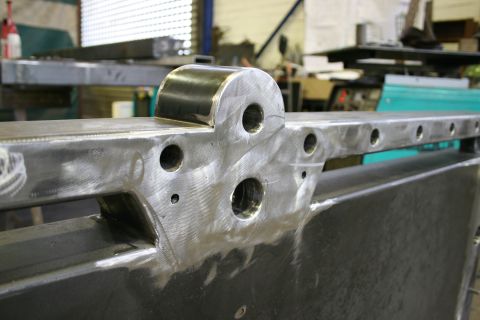 1973 Ford Ranchero - Close-up of a fabricated metal component with various drilled holes and a welded bracket, likely for industrial use.