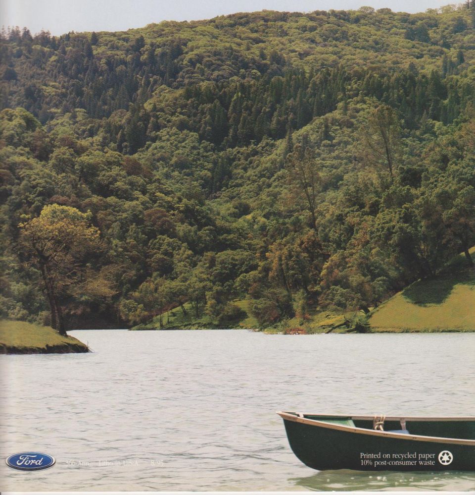 Ford brochure back cover with a green rowboat on a lake below forested hills and the Ford oval