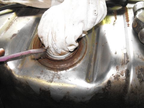 1986 Ford Bronco - I gently brushed most of the dirst and rust away, from around the unit before removal. Now, with a rag in place, I'm brushing the rest of t…