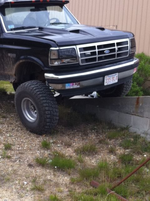 1993 Ford Bronco - This 1993 Ford Bronco features a lifted suspension and aggressive off-road tires, giving it a commanding presence.