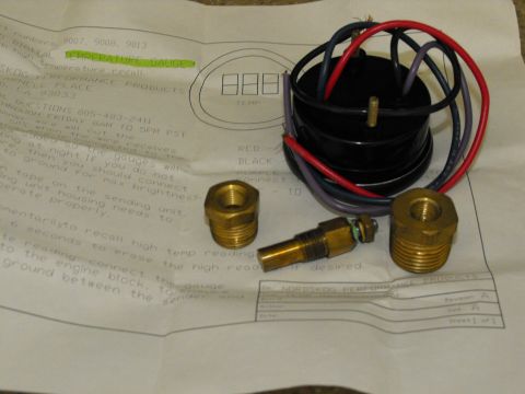 1994 Ford Bronco - Uninstalled digital temperature gauge kit includes gauge, sender, fittings, and instructions.