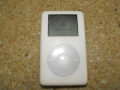 1994 Ford Bronco - This iPod Classic has a cracked screen and shows a folder icon.