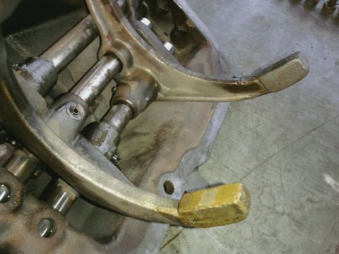 1995 Ford Bronco - This image shows a close-up of internal transmission components, specifically a shift fork and linkage mechanism.