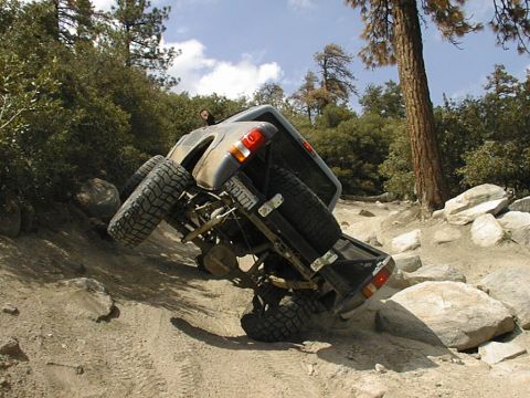 1997 Ford Ranger - Ford Ranger navigating difficult off-road terrain on a sunny day.