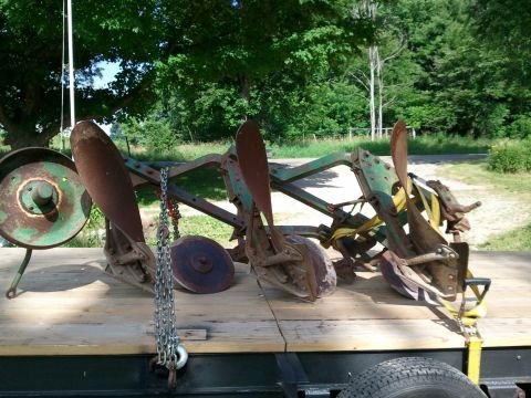 1985 Ford F-150 - This agricultural implement is loaded onto a trailer, ready for transport.