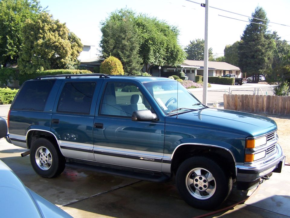 Teal 1995 Chevrolet Tahoe parked on driveway, 3q-front view