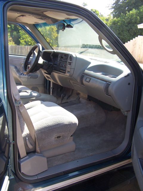 1995 Chevrolet Tahoe - Interior view of a 1995 Chevrolet Tahoe, highlighting the dashboard and seating.