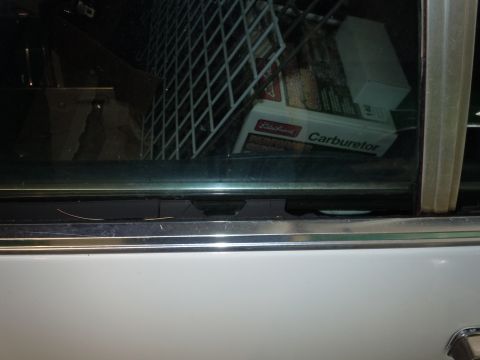 2001 Ford Crown Victoria - A box for an Edelbrock carburetor is visible inside the vehicle's interior.