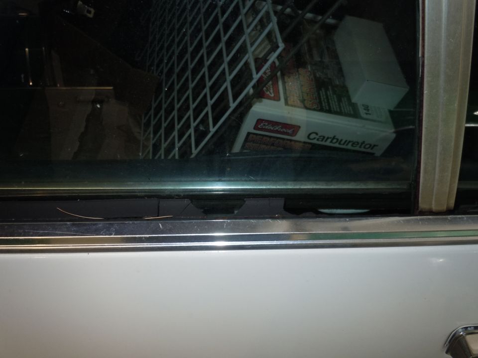 Interior view of a car showing a box labeled 'Edelbrock Carburetor'