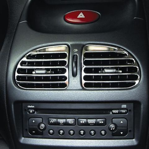 1991 Ford LTD Crown Victoria - Close-up of a car's dashboard, focusing on the air conditioning vents and the car stereo system.