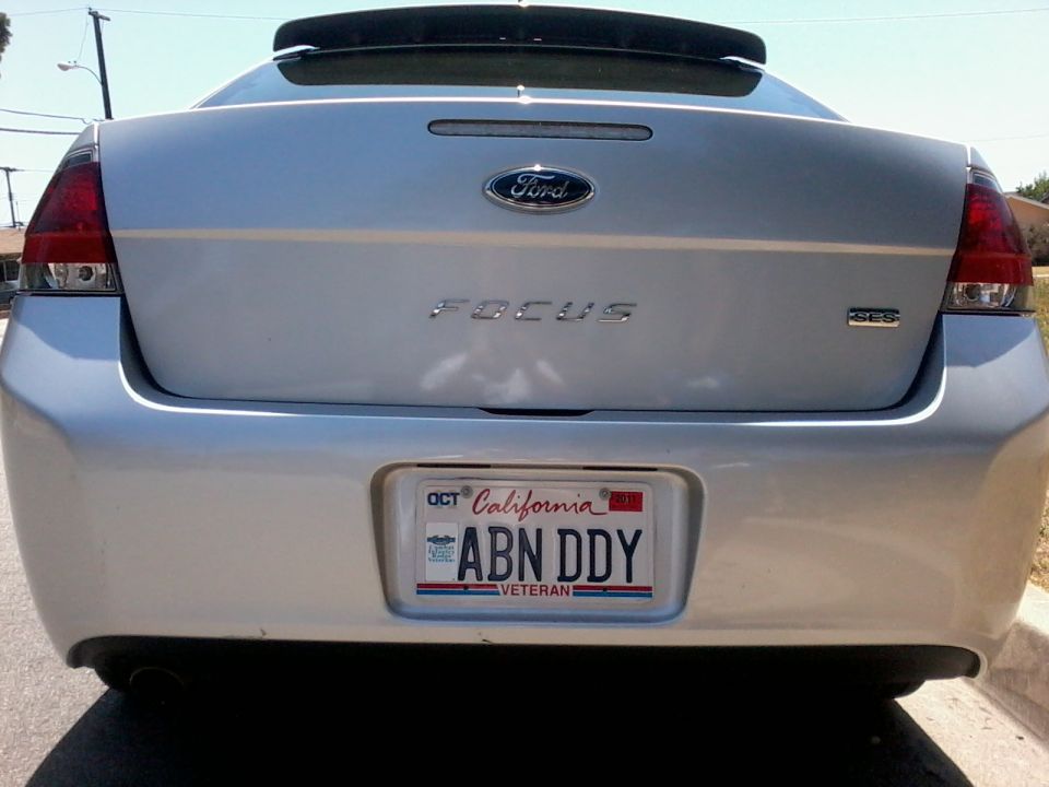 Silver 2010 Ford Focus sedan rear view with California license plate ABN DDY