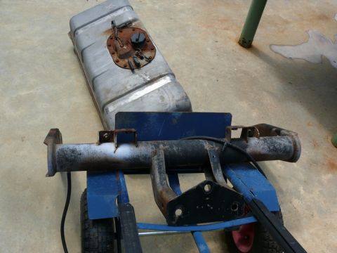 1976 Chevrolet Corvette - Fuel tank and rear axle assembly are shown on a blue dolly.