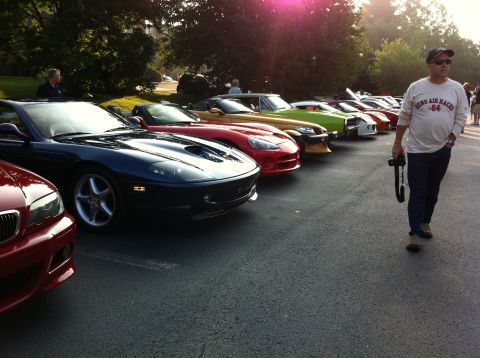2010 Ford Falcon - Cars and Coffee event with multiple sports cars on display.