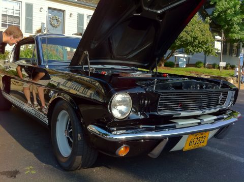 2010 Ford Falcon - Black 1965 Ford Mustang Shelby GT350, hood open, parked outdoors.