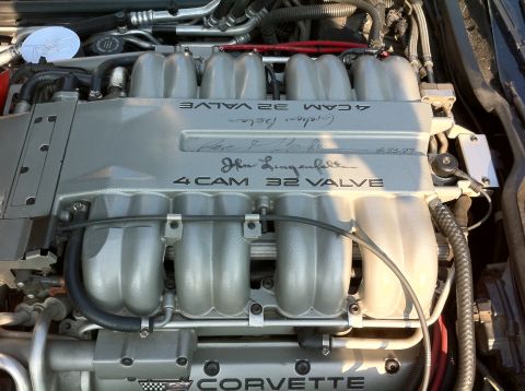 2010 Ford Falcon - The engine bay of a Corvette shows a "4 CAM 32 VALVE" configuration, with "John Lingenfelter" inscribed on the cover.
